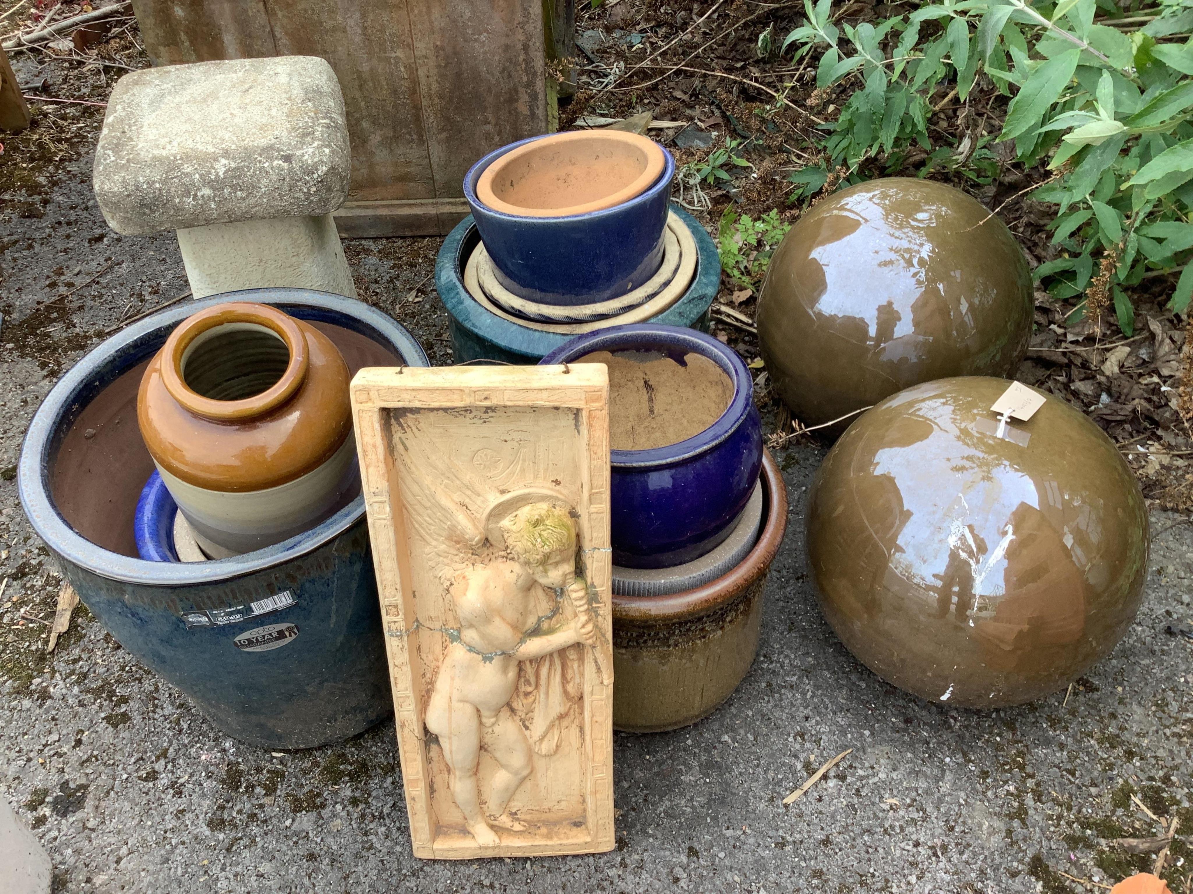 Twelve assorted garden planters, a reconstituted staddle stone, wall plaque and a pair of ball finials, largest height 46cm